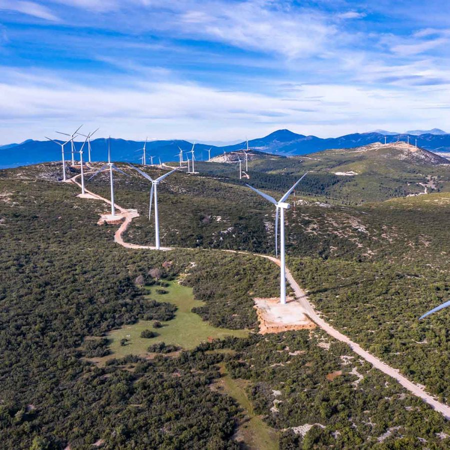 wind-turbines-renewable-energy-on-a-green-hill-win-PUCR2VL.jpg